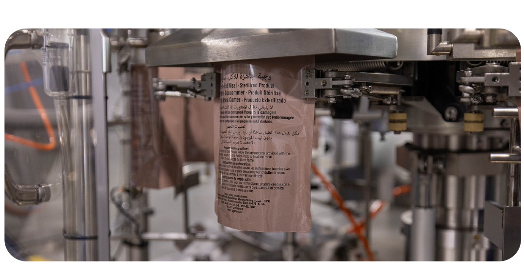Automated rotary pouch filling and heat sealing machinery for shelf-stable retort packaging
